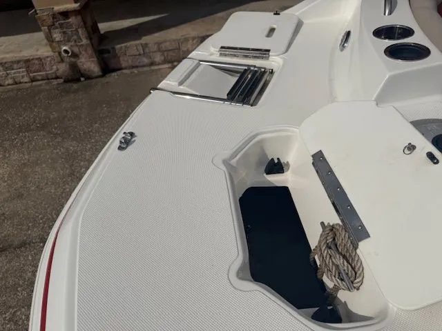 Slide: The Image of Deck of a 2014 Hurricane SSR188 boat with rope and storage compartments. - 19