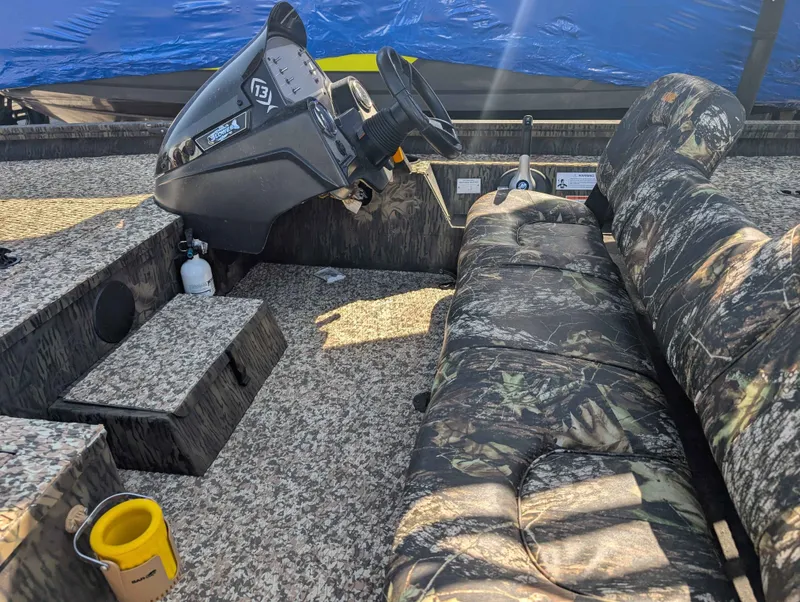 Slide: The Image of Interior of a 2018 Lowe Stinger 175C boat with camouflage pattern. - 6