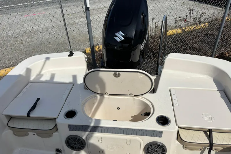 Slide: The Image of 2023 Carolina Skiff 21 LS boat interior with Suzuki outboard motor. - 4