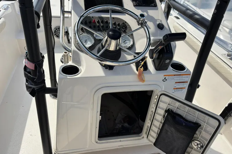 Slide: The Image of 2023 Carolina Skiff 21 LS boat console with steering wheel and controls. - 7