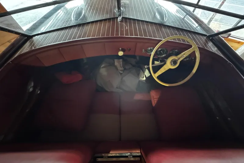 Slide: The Image of Interior of a 1948 Chris-Craft Sportster 25 boat with vintage steering wheel and dashboard. - 15