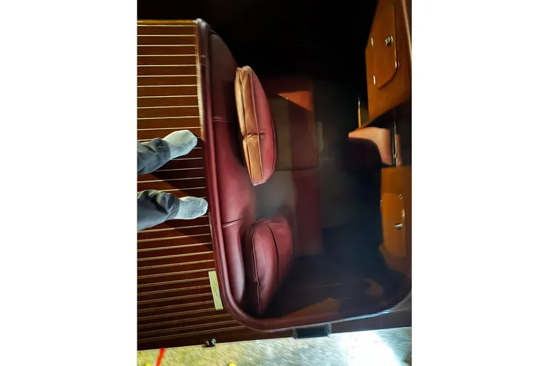 Slide: The Image of Interior of 1948 Chris-Craft Sportster 25 with red leather seats and wooden paneling. - 20