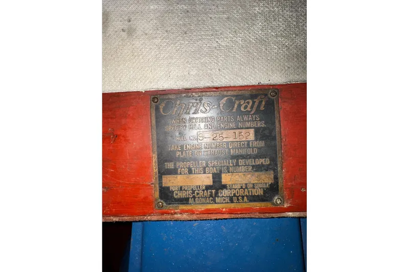 Slide: The Image of 1948 Chris-Craft Sportster 25 identification plate with hull and engine details. - 21