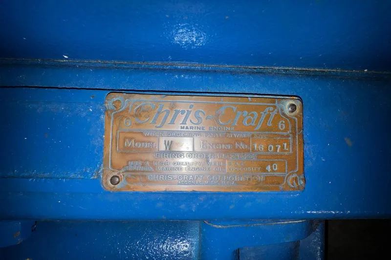 Slide: The Image of 1948 Chris-Craft Sportster 25 engine plate, blue background, model W, engine number 18071. - 22