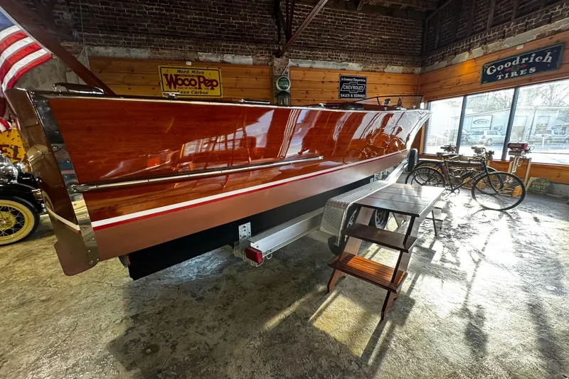 Slide: The Image of 1948 Chris-Craft Sportster 25 boat displayed indoors with vintage decor. - 8
