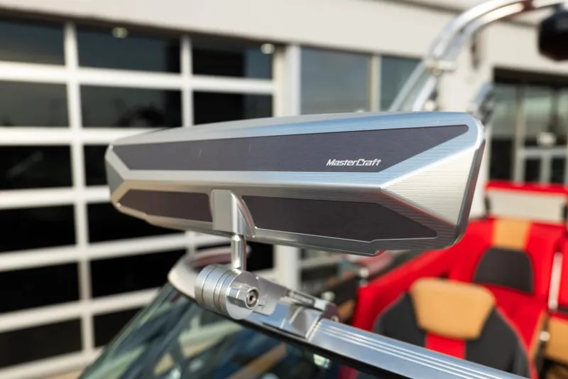 Slide: The Image of Close-up of 2021 MasterCraft X24 boat's sleek rearview mirror design. - 11