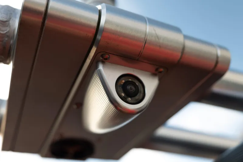 Slide: The Image of Close-up of a 2021 MasterCraft X24 boat camera, mounted on a metal frame. - 17