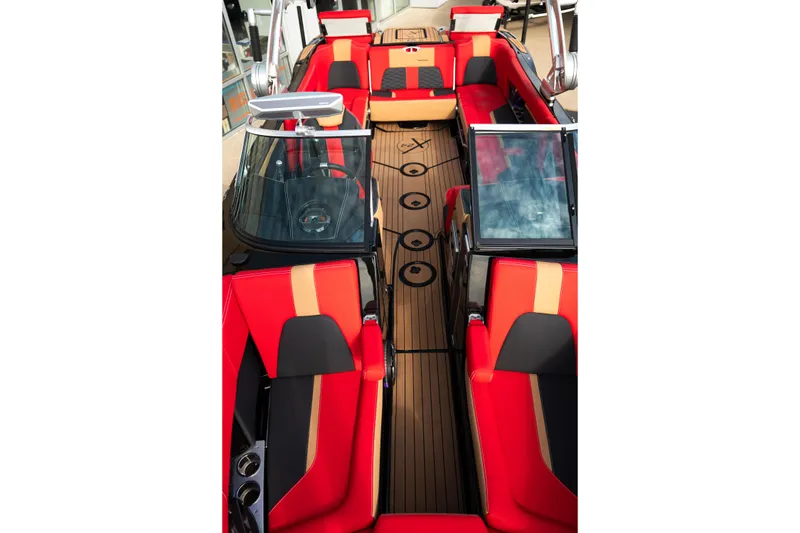 Slide: The Image of 2021 MasterCraft X24 boat interior with red and black seating, sleek design. - 20