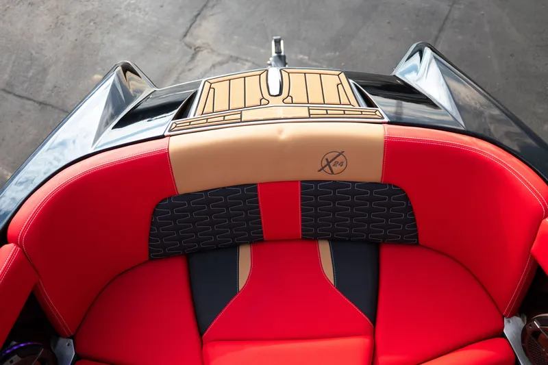 Slide: The Image of Red and tan seating on 2021 MasterCraft X24 boat, featuring stylish design. - 21