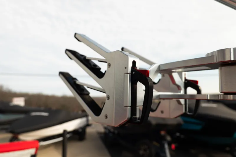 Slide: The Image of Close-up of 2021 MasterCraft X24 boat rack in a marina setting. - 29