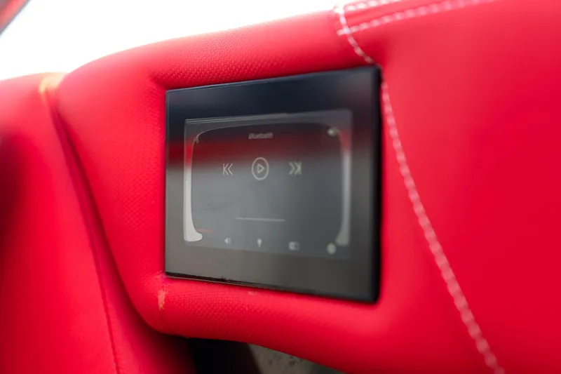 Slide: The Image of Red interior of 2021 MasterCraft X24 with touchscreen control panel. - 30