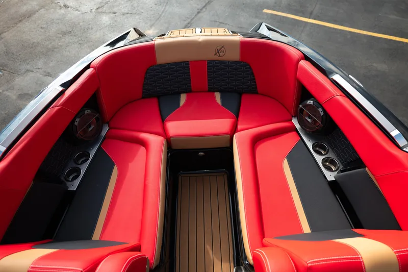 Slide: The Image of Luxurious red and black seating in 2021 MasterCraft X24 boat interior. - 31