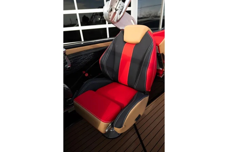 Slide: The Image of 2021 MasterCraft X24 boat seat with red and black upholstery, showcasing luxury design. - 32