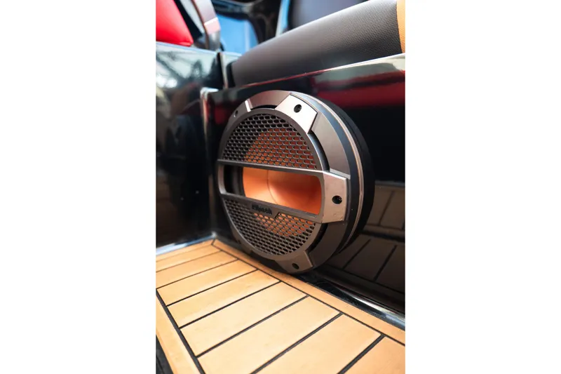 Slide: The Image of 2021 MasterCraft X24 boat speaker with sleek design on wooden deck. - 38