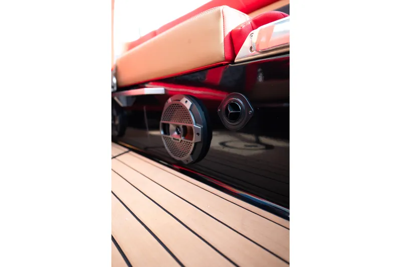 Slide: The Image of 2021 MasterCraft X24 boat interior with speaker and teak flooring. - 39