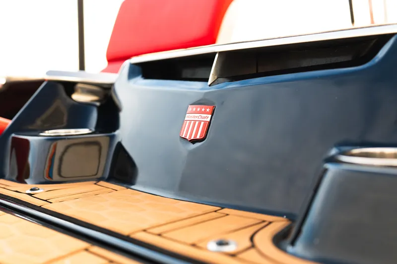 Slide: The Image of 2021 MasterCraft X24 boat with sleek design and vibrant red seating. - 42