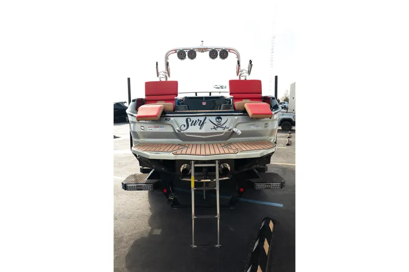 Slide: The Image of 2021 MasterCraft X24 boat with red seating and surf-themed design at the rear. - 5