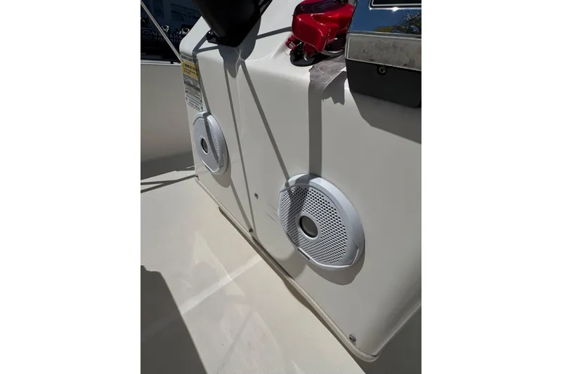 Slide: The Image of 2003 Boston Whaler 170 Montauk boat interior with speakers and control panel. - 13