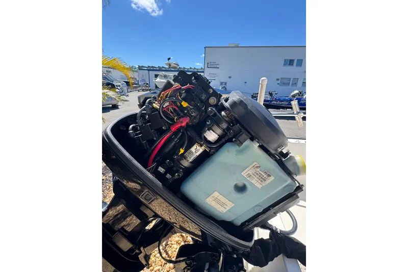 Slide: The Image of 2003 Boston Whaler 170 Montauk outboard motor with exposed engine components. - 15