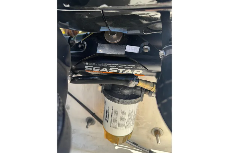 Slide: The Image of Close-up of SeaStar hydraulic steering system on 2003 Boston Whaler 170 Montauk boat. - 16