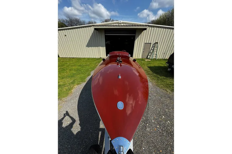 Slide: The Image of 2014 Hacker-Craft 26' Runabout in front of a garage under a blue sky. - 10