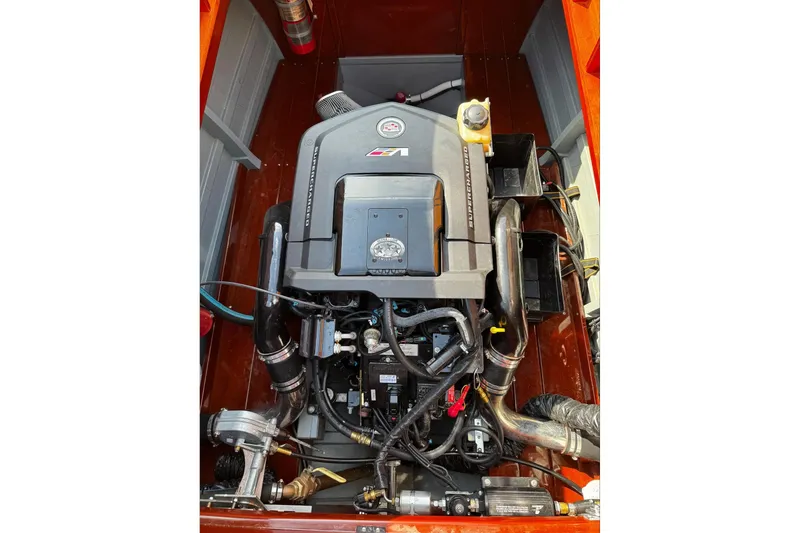 Slide: The Image of Engine of 2014 Hacker-Craft 26' Runabout, showcasing detailed components and layout. - 19