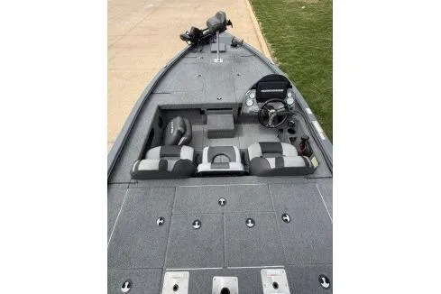Slide: The Image of 2018 Lund 1875 Pro-V Bass boat interior with seating and control panel. - 3