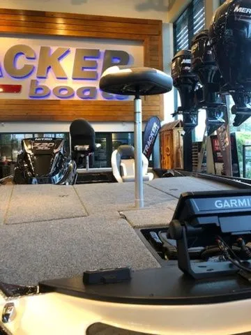Slide: The Image of 2026 Nitro Z20 XL boat in showroom with Garmin equipment. - 7