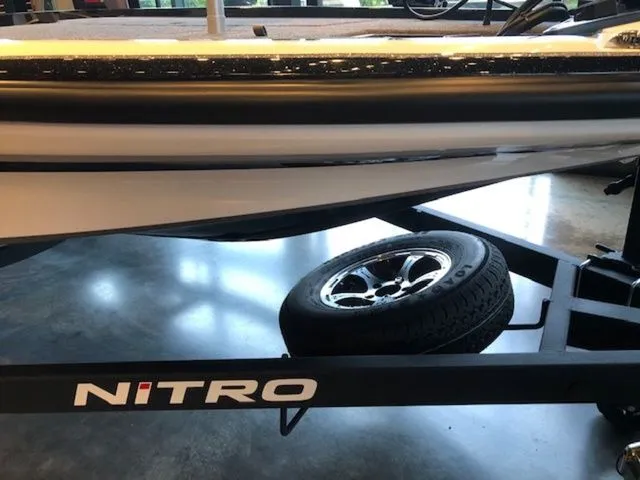 Slide: The Image of 2026 Nitro Z20 XL boat on trailer in showroom. - 8