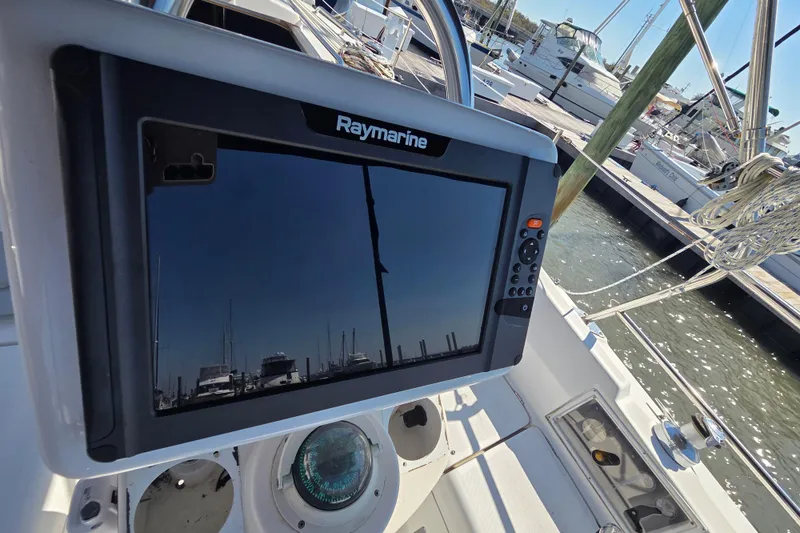 Slide: The Image of Raymarine navigation system on a 2005 Hunter 31 sailboat at a marina. - 11