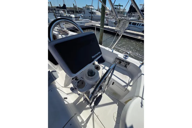 Slide: The Image of Cockpit of 2005 Hunter 31 sailboat with Raymarine navigation system at marina. - 12