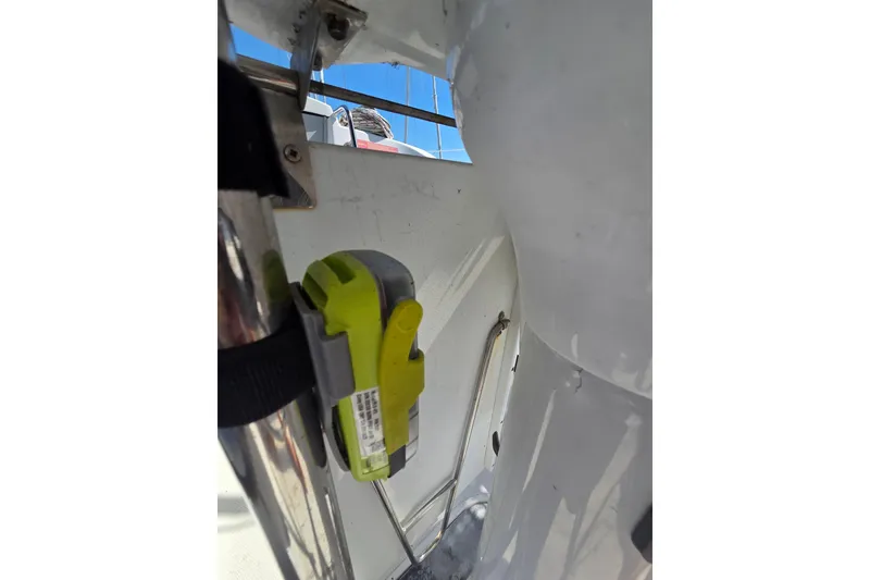 Slide: The Image of Safety equipment on a 2005 Hunter 31 sailboat, secured with a strap. - 13