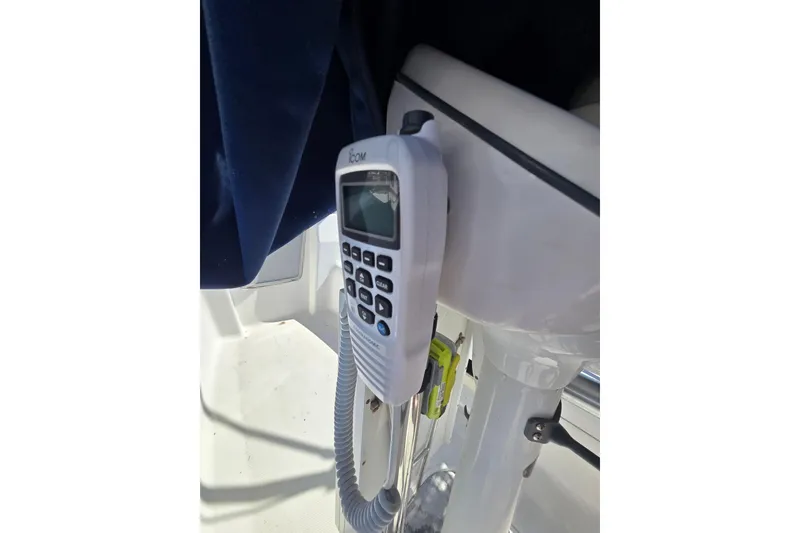 Slide: The Image of VHF radio on a 2005 Hunter 31 sailboat cockpit. - 14