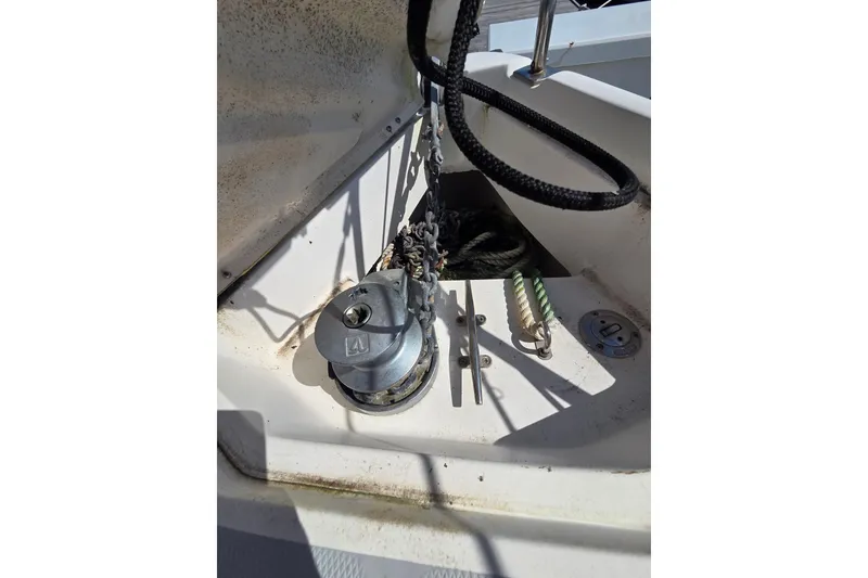 Slide: The Image of Anchor windlass and ropes on a 2005 Hunter 31 sailboat deck. - 17