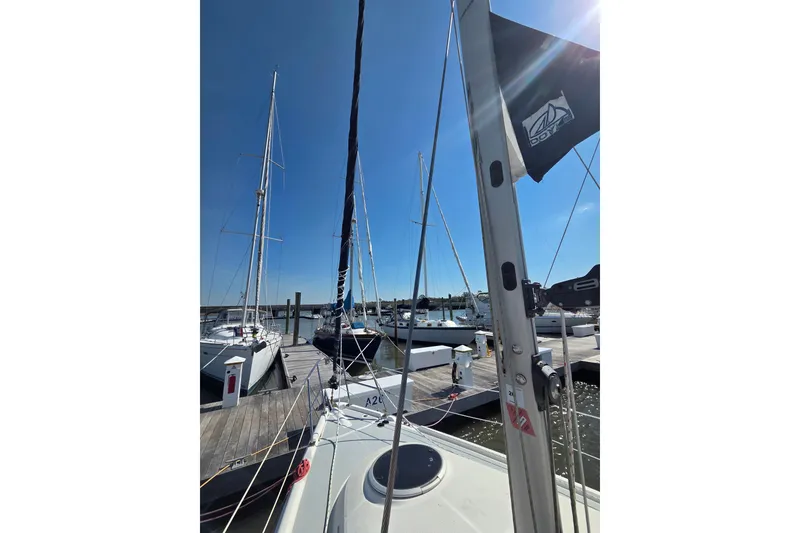 Slide: The Image of Sailboat docked at marina, Hunter 31 model, 2005, under clear blue sky. - 19