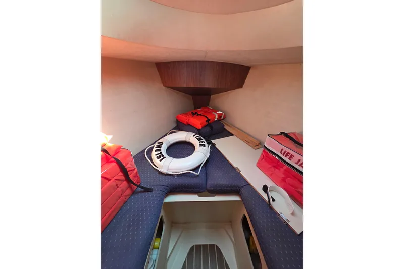 Slide: The Image of Interior cabin of 2005 Hunter 31 sailboat with life jackets and safety equipment. - 7
