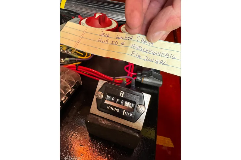 Slide: The Image of 2016 Hacker-Craft 28 Sport hour meter with handwritten note displaying hull ID. - 18