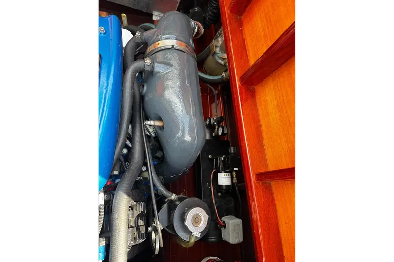 Slide: The Image of Engine compartment of a 2016 Hacker-Craft 28 Sport boat, showcasing mechanical components. - 21