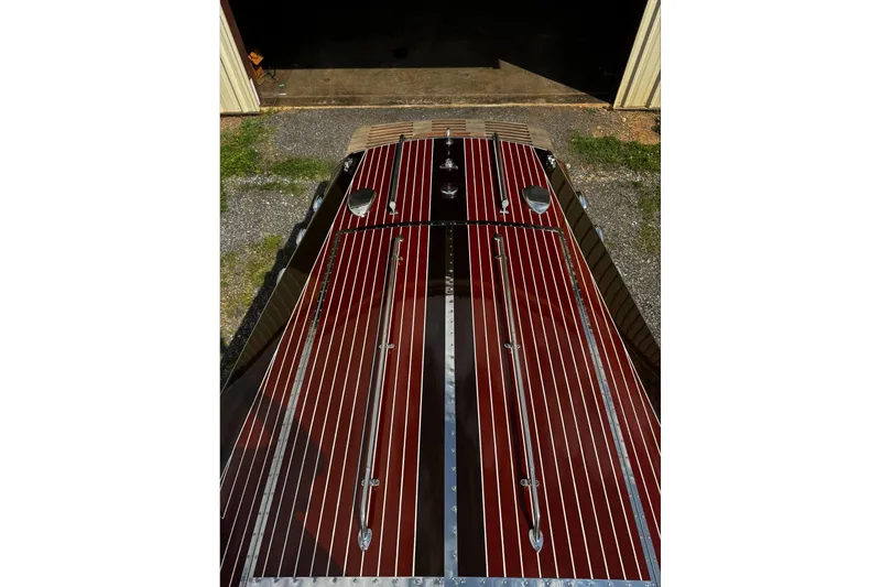 Slide: The Image of 2016 Hacker-Craft 28 Sport boat with polished wood finish and chrome details. - 6