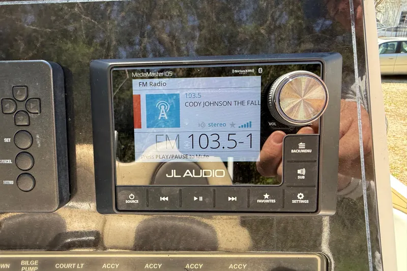 Slide: The Image of JL Audio MediaMaster display on 2016 Tidewater 2110 Bay Max boat console. - 12