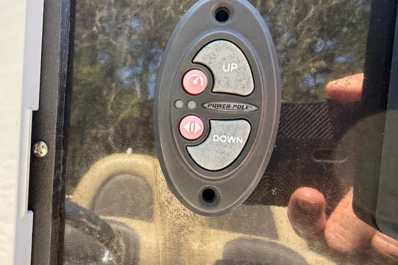 Slide: The Image of Control panel on a 2016 Tidewater 2110 Bay Max boat with Power-Pole buttons. - 14
