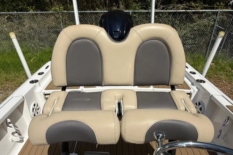 Slide: The Image of 2016 Tidewater 2110 Bay Max boat with beige and gray seating. - 15