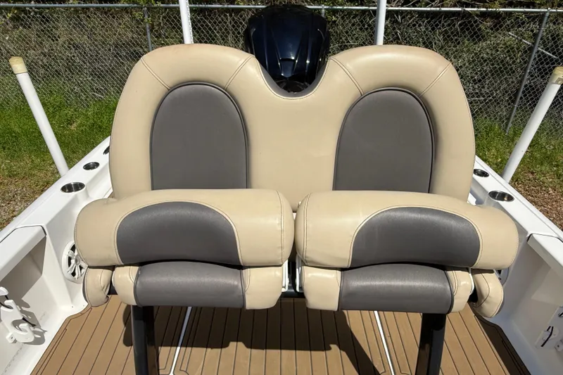 Slide: The Image of 2016 Tidewater 2110 Bay Max boat with dual cushioned seats and sleek design. - 16