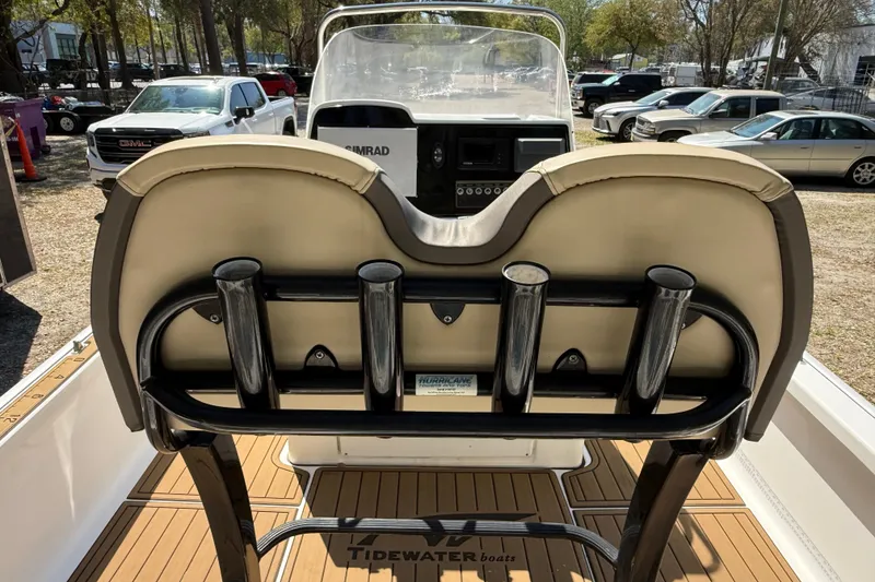 Slide: The Image of 2016 Tidewater 2110 Bay Max boat interior with rod holders and Simrad console. - 17