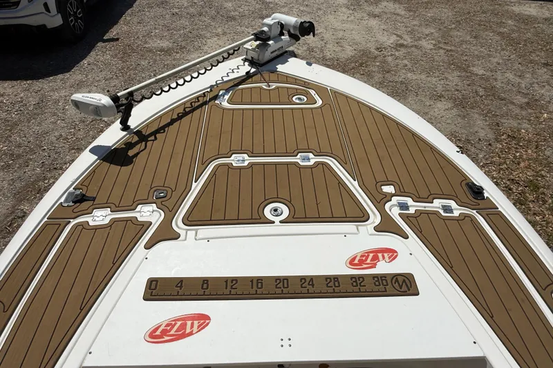 Slide: The Image of 2016 Tidewater 2110 Bay Max boat deck with trolling motor and FLW logo. - 18