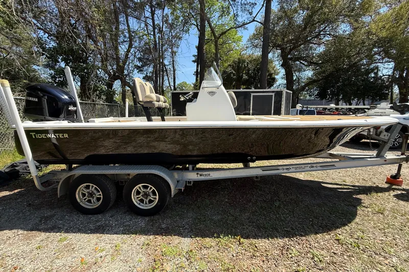 Slide: The Image of 2016 Tidewater 2110 Bay Max boat on trailer, parked outdoors. - 2