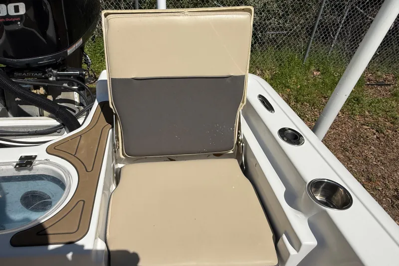 Slide: The Image of 2016 Tidewater 2110 Bay Max boat seat with cup holders and engine detail. - 22