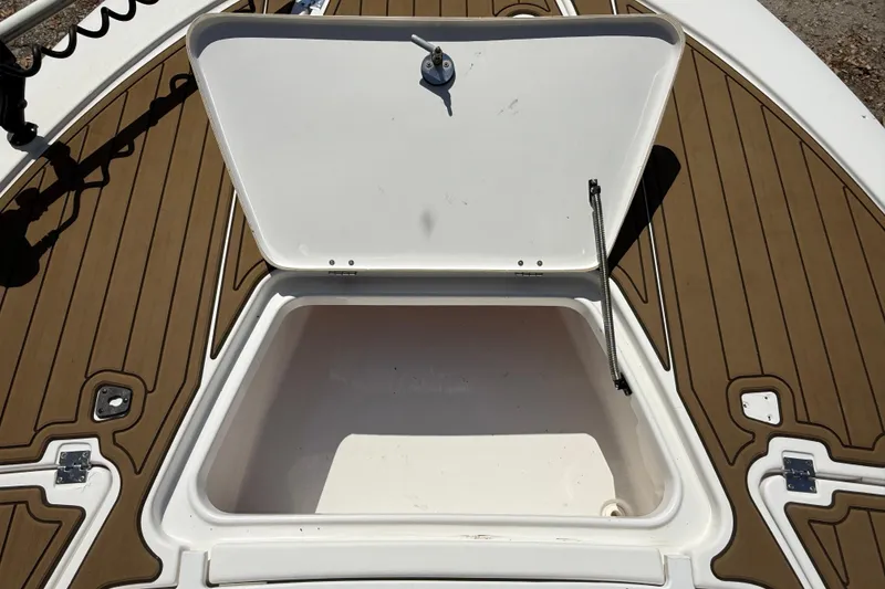 Slide: The Image of Open storage compartment on 2016 Tidewater 2110 Bay Max boat deck. - 25
