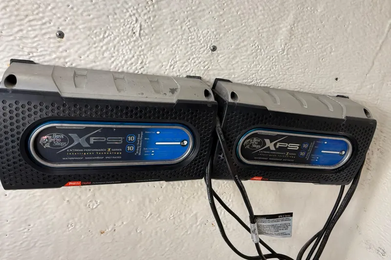 Slide: The Image of Bass Pro Shops XPS battery chargers mounted on a wall, suitable for Tidewater 2110 Bay Max 2016. - 29