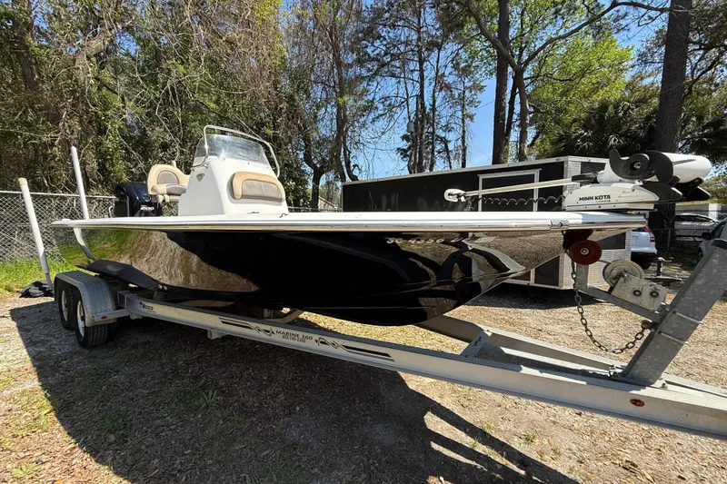 Slide: The Image of 2016 Tidewater 2110 Bay Max boat on trailer, parked outdoors. - 3